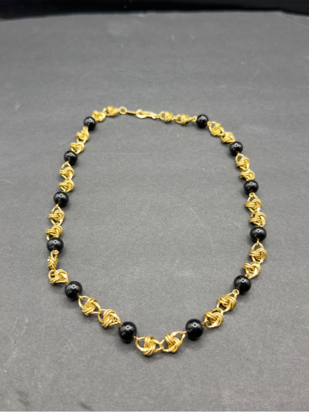 GOLDTONE necklace with black beads